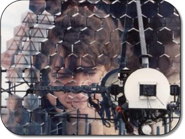 Camper views herself in reflection from the multi-aperture Veritas Gamma Ray Telescope on Mt. Hopkins. Camper views herself in reflection from the multi-aperture Veritas Gamma Ray Telescope on Mt. Hopkins.