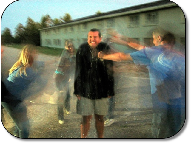 Camp staff gets drenched by Campers. Camp staff gets drenched by Campers.